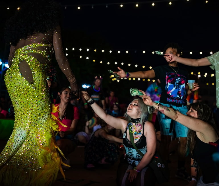 Dominique Zaire accepts tips at Pride Party at Bass Street Landing June 15.