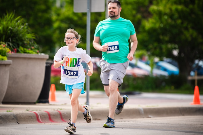 Father and daughter in Pride 5K June 15