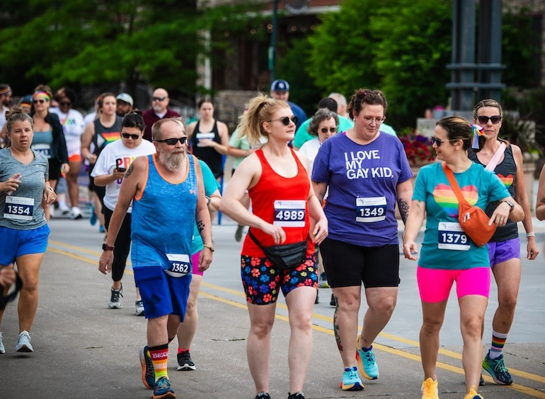 Group walks in the Pride 5K Walk Run & Roll June 15